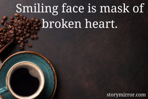Smiling face is mask of broken heart.